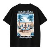 Blue NOVEINO Ocean T-shirt with ocean wave graphic, soft cotton fabric, casual fit, and vibrant blue color.