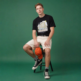 NOVEINO t-shirt with corner design, white fabric, and casual fit, shown on a model in a fashion photoshoot.